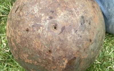 Found a giant ~150 lb. steel ball in a creek near my house. It has tiny boreholes and leaked black liquid when we rolled it around. Any ideas?